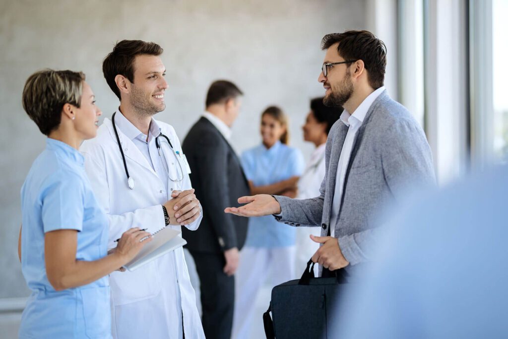 A broker meeting with clinical staff at a healthcare agency